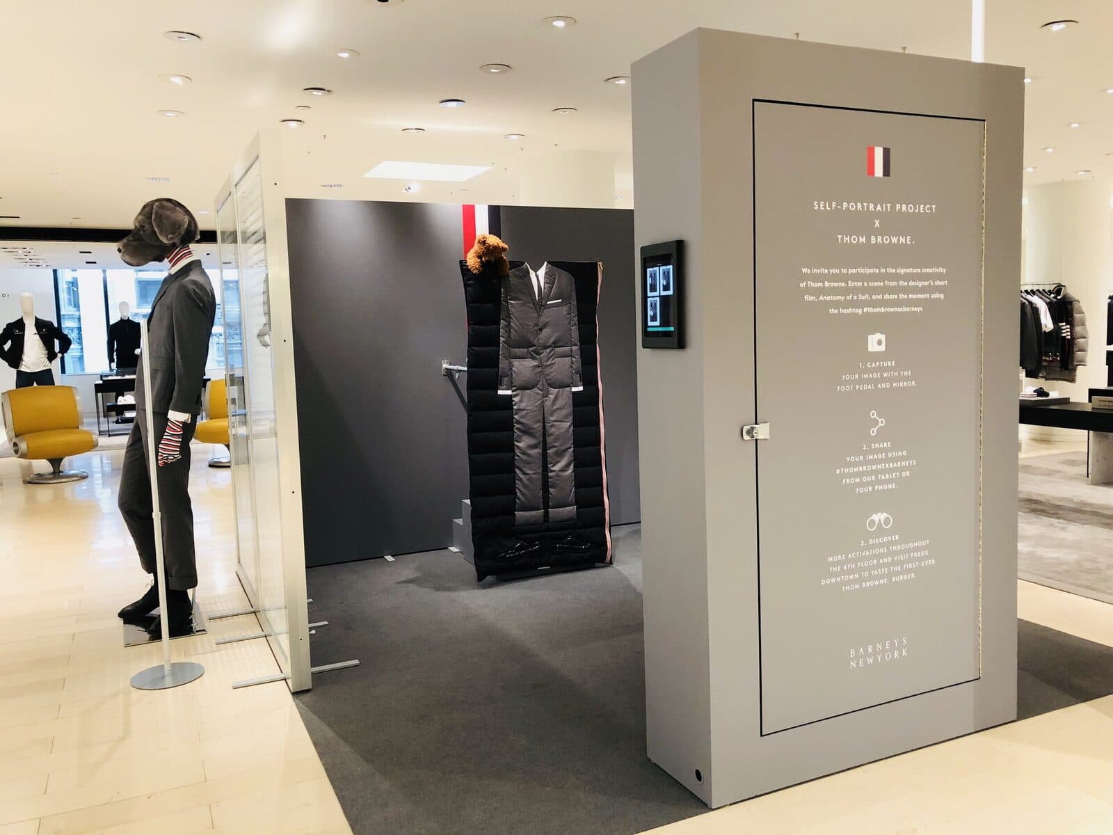 The Self-Portrait Project monolith on the Barneys fourth floor, beside the Thom Browne display.